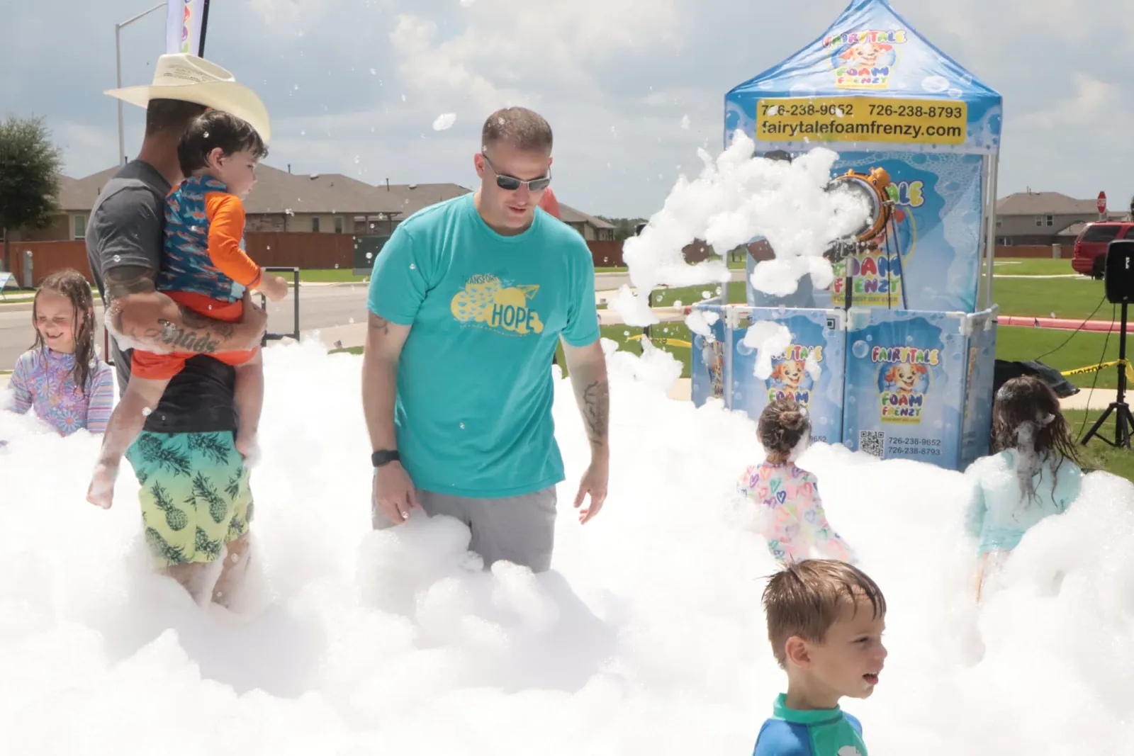 A child covered head to toe in party foam